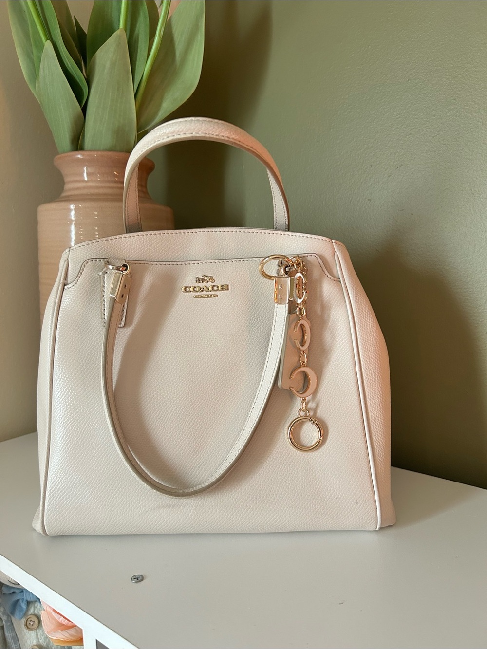 Coach Pebble Leather Cream Satchel with Gold Charm